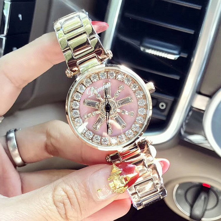 Montre d'ambiance en or rose avec coque et diamants