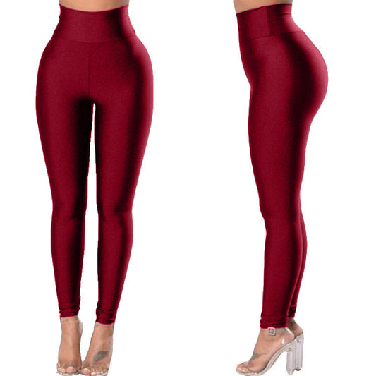 Pantalones de yoga ajustados para mujer Pantalones deportivos de color sólido Leggings de levantamiento de cadera de nueve puntos