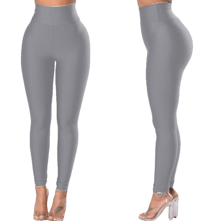 Pantalones de yoga ajustados para mujer Pantalones deportivos de color sólido Leggings de levantamiento de cadera de nueve puntos